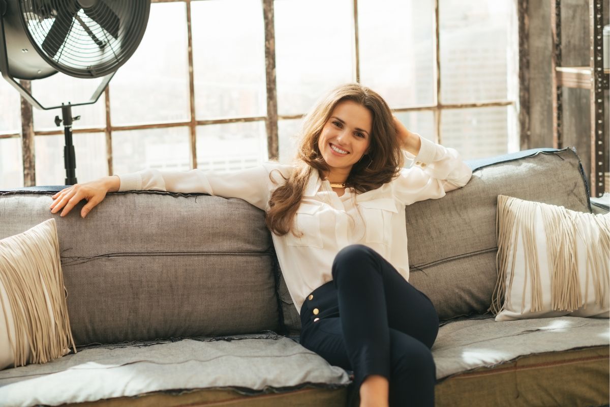 Picture of a woman sitting on a couch.