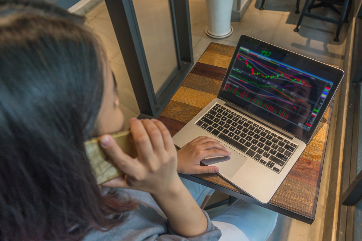 Photo of a woman trading stocks online.
