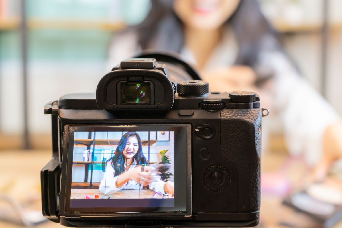 Picture of a woman filming herself.
