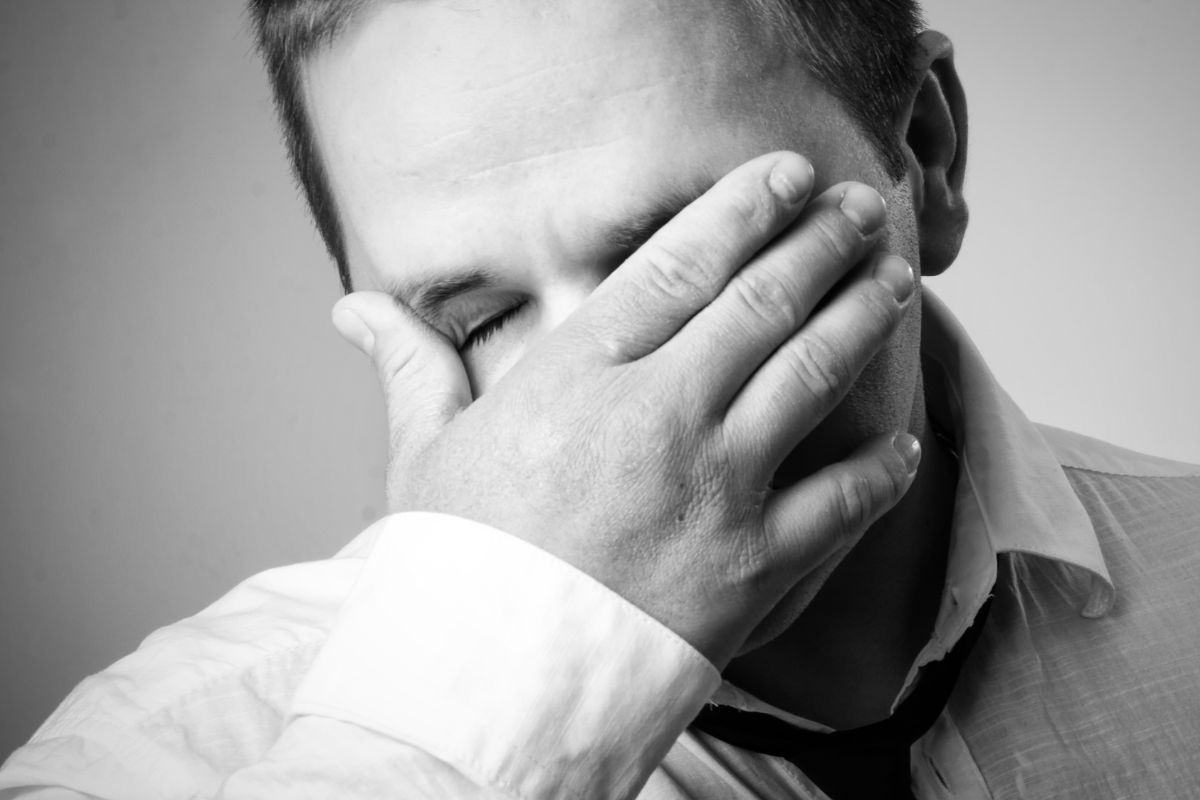 Photo of a man regretting.