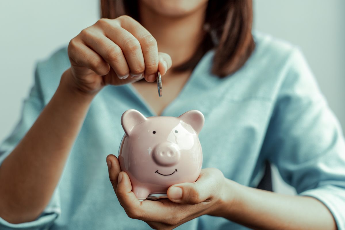 Image of a woman saving money.
