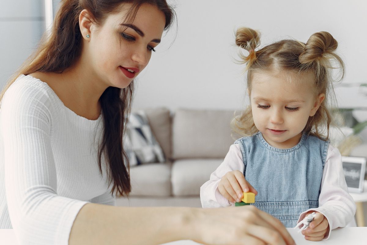 Picture of a young woman babysitting.