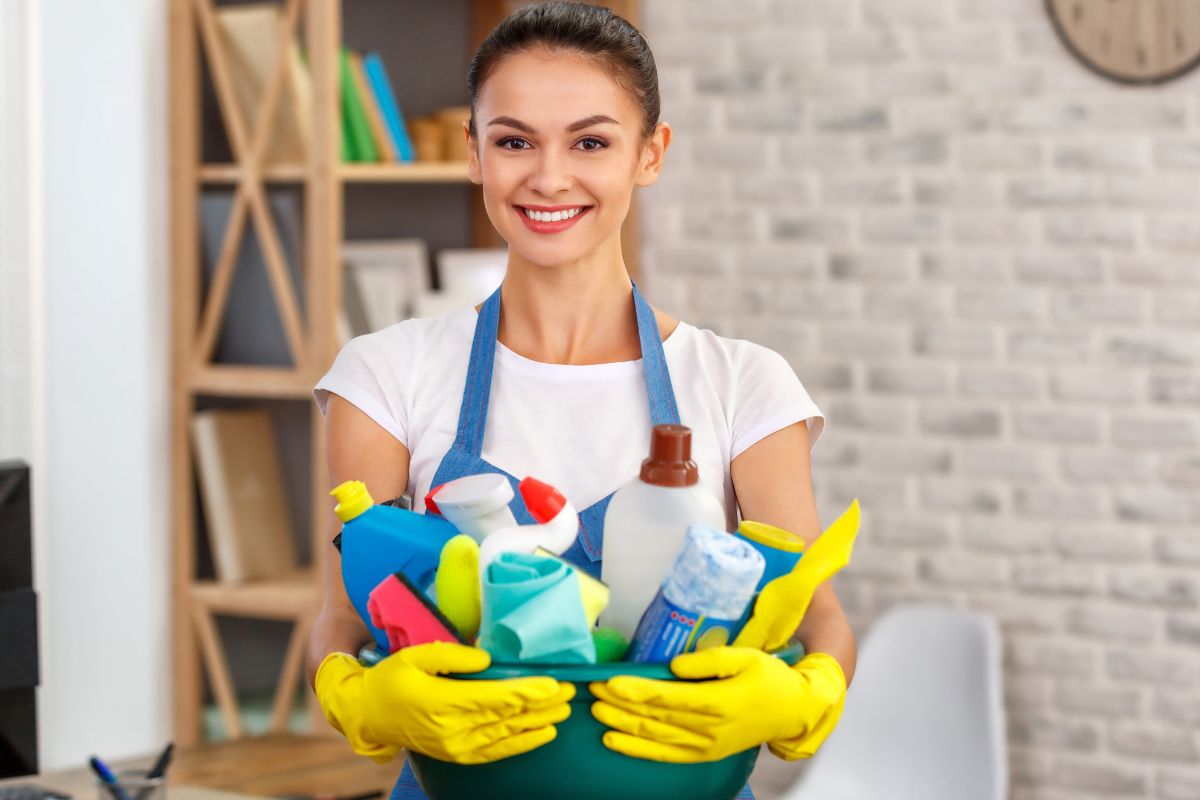 Picture of a young lady cleaning a house.
