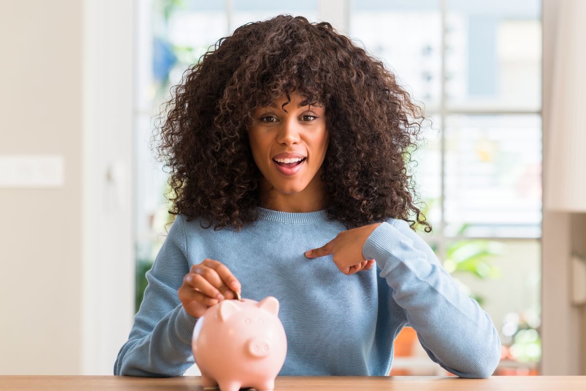 Picture of a young lady saving money.
