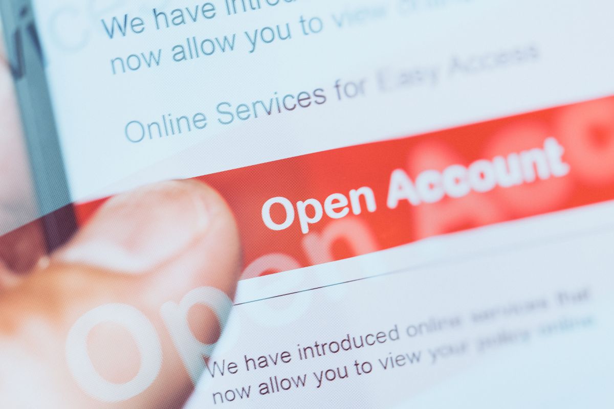 A man's hand opening an account.