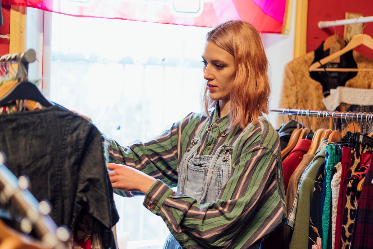 Image of a woman shopping at the thrift store.
