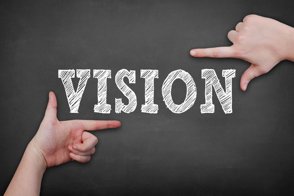 A woman's hand and a vision wording.