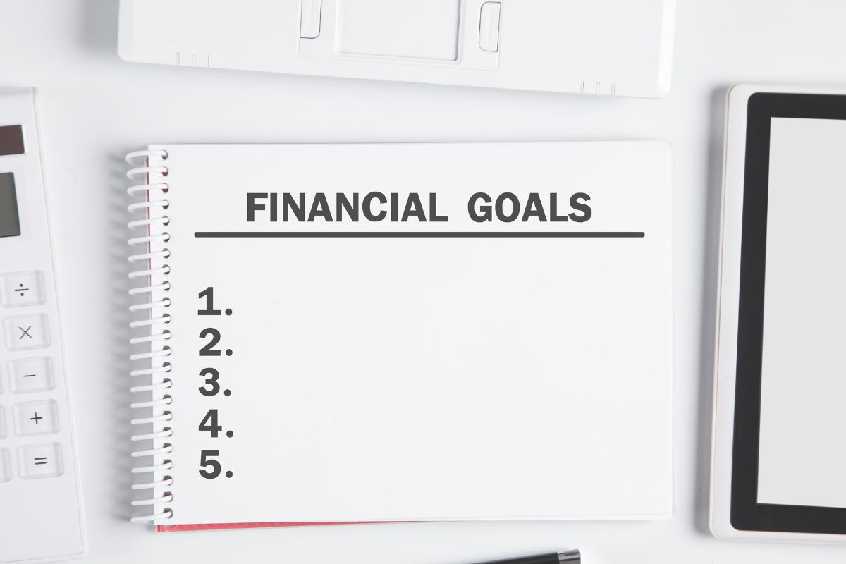 Image of a notebook with financial goals.