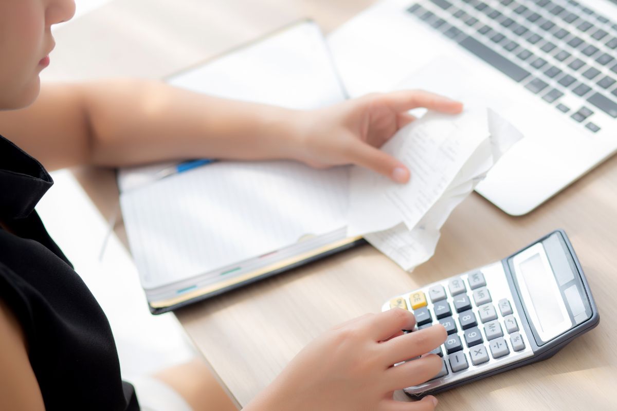 Picture of a woman tracking her expenses.