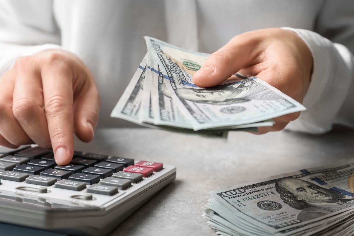 A woman's hand calculating money.
