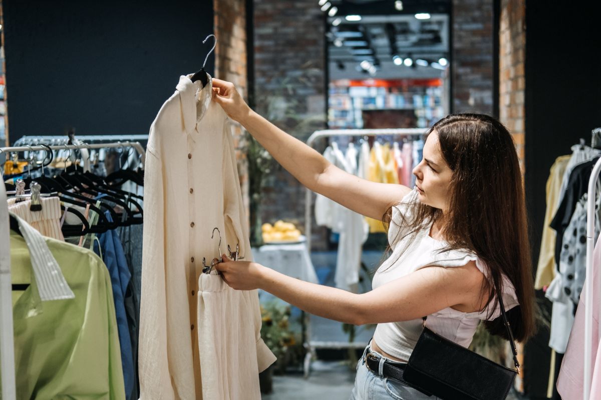 Photo of a woman shopping for clothes.