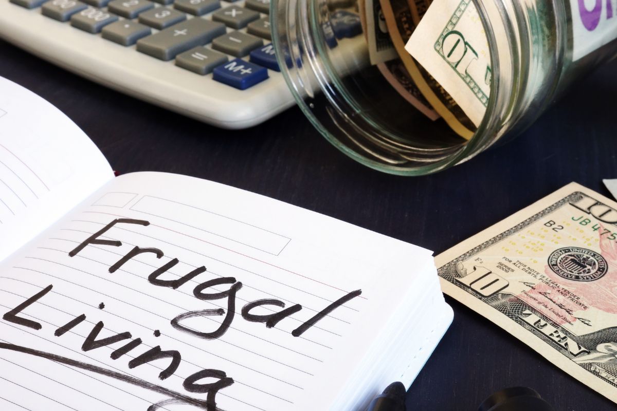 Photo of a notebook with frugal living wording,