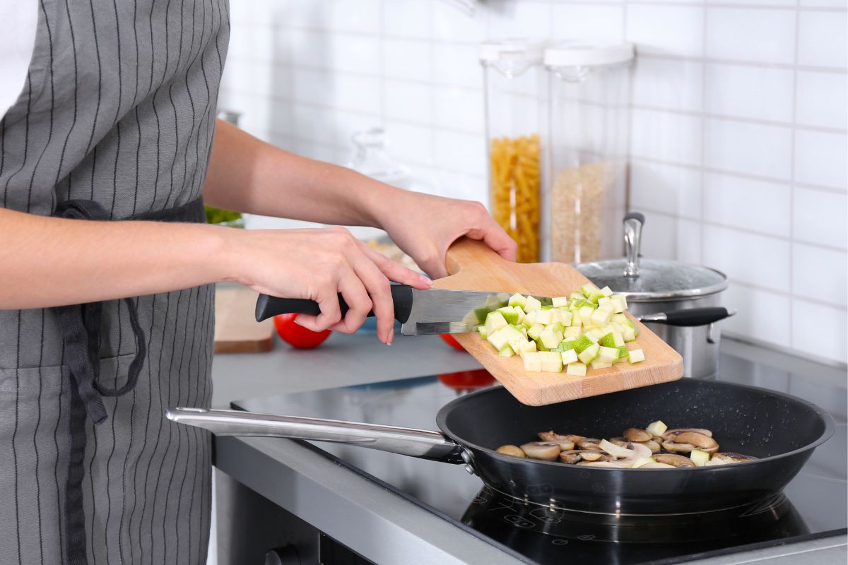 The picture shows a woman cooking.