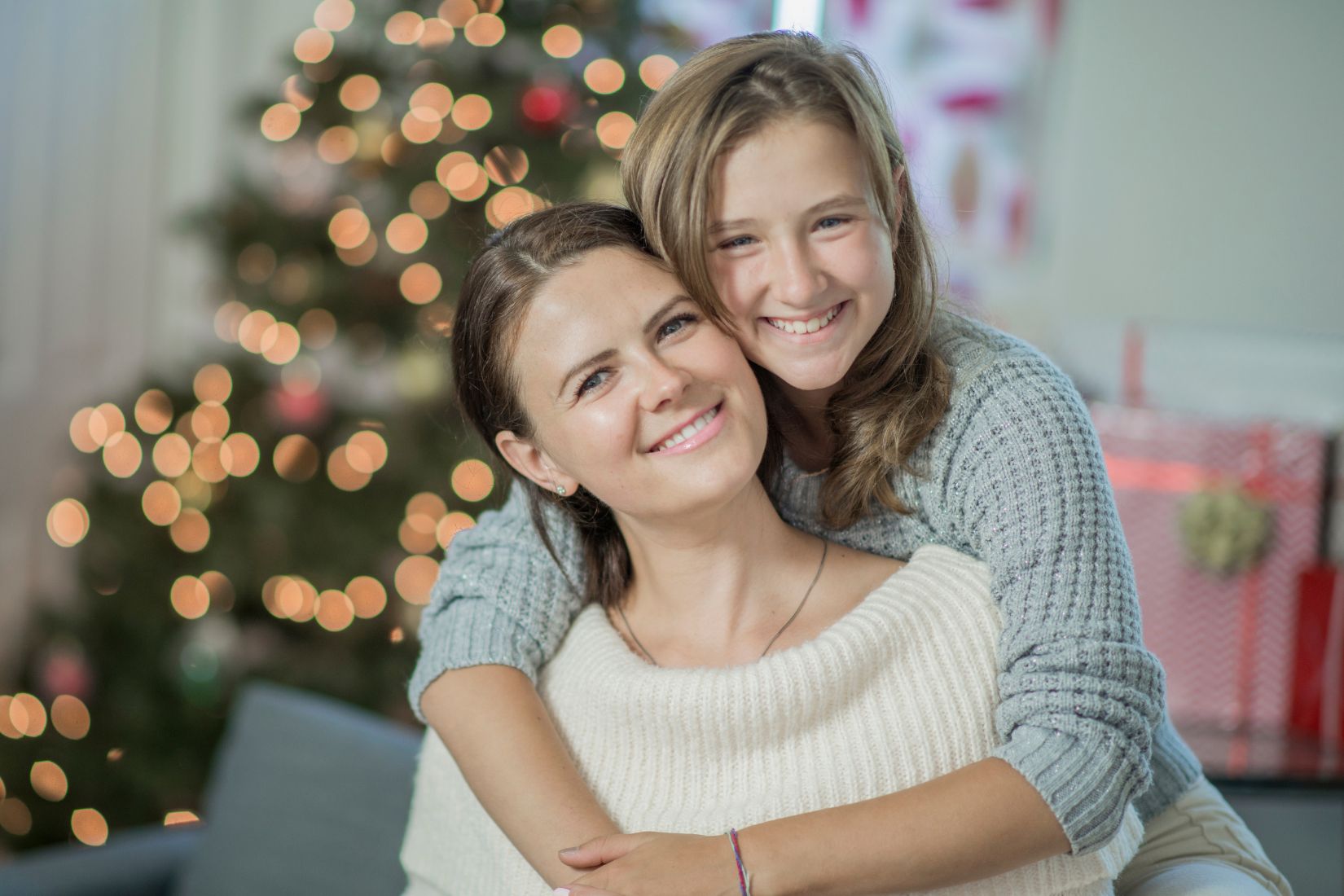 Image of a mother and daughter embracing.
