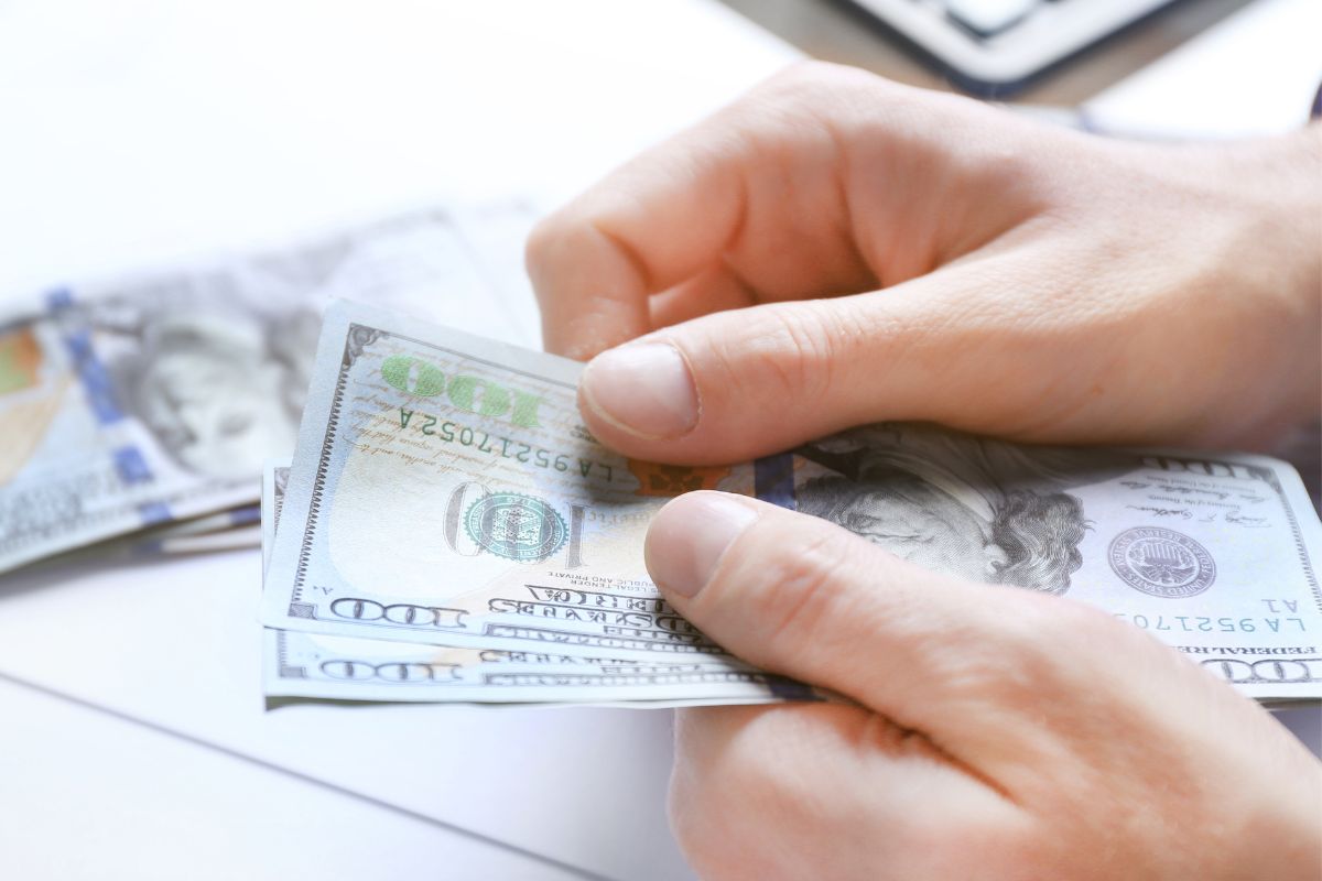 Imagine that the hand of a man counts money.          