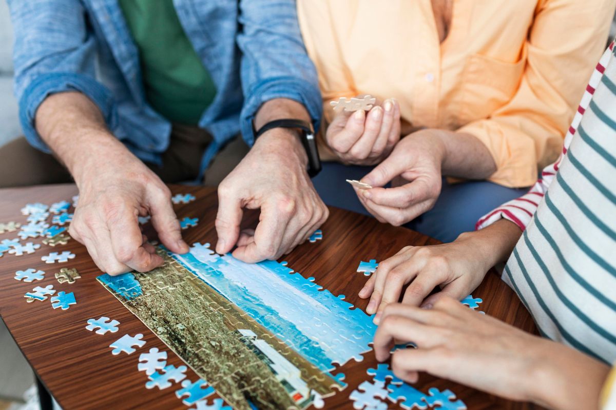 The image shows a family playing a puzzle game.