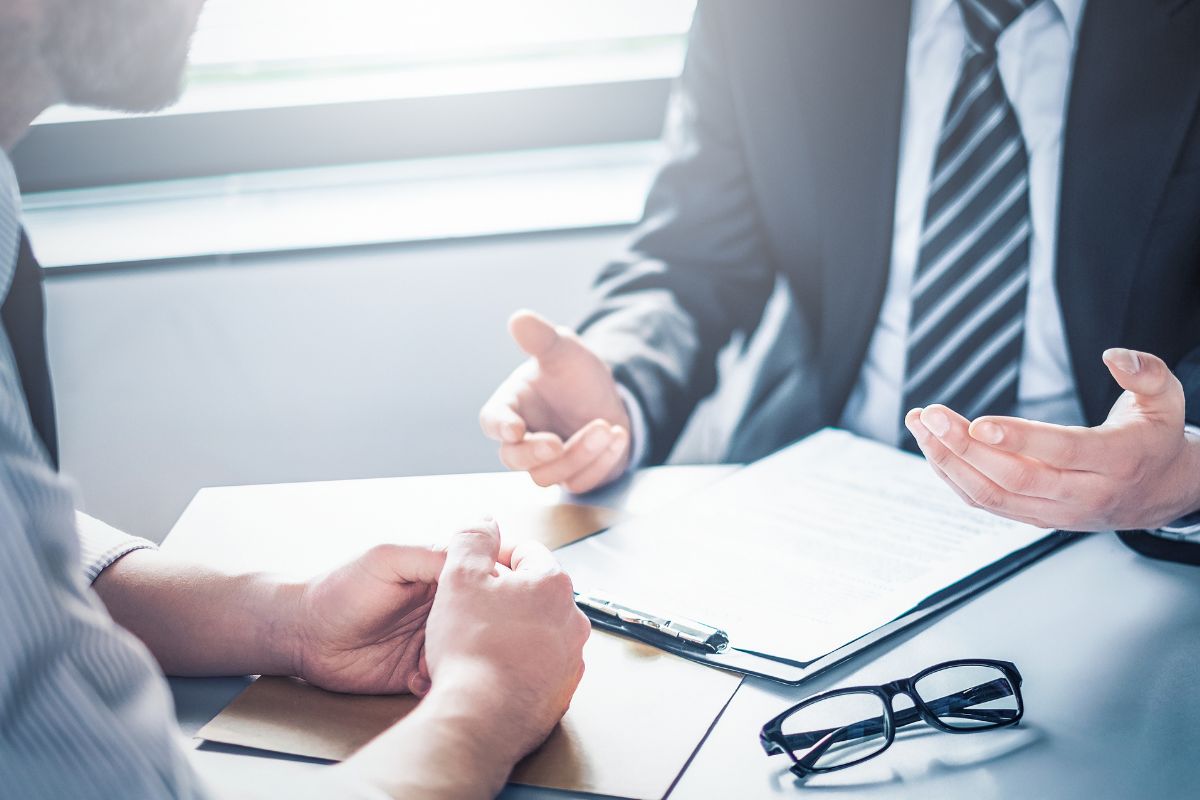 Photo of a man negotiating with a creditor.