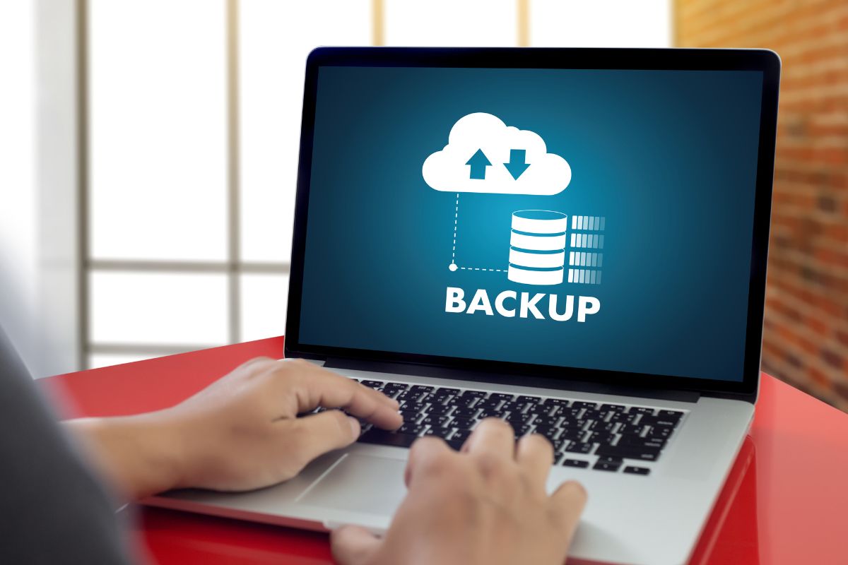 Picture of a man's hand backing up his data.