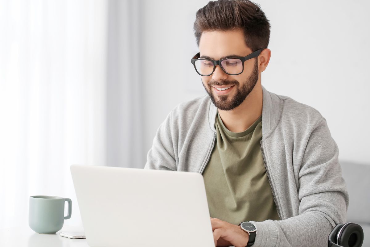 Picture of a man using a laptop.
