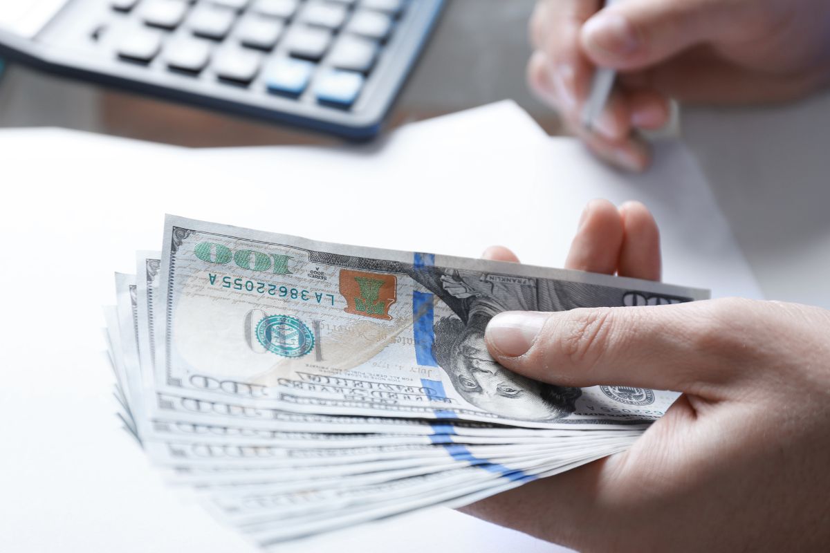 Picture of man's hand not spending his money.