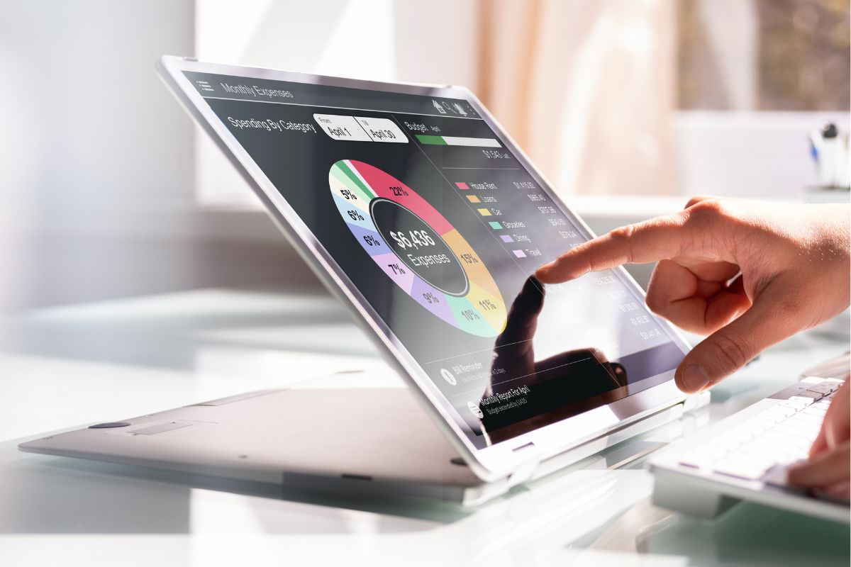 A woman's hand using a budgeting app.