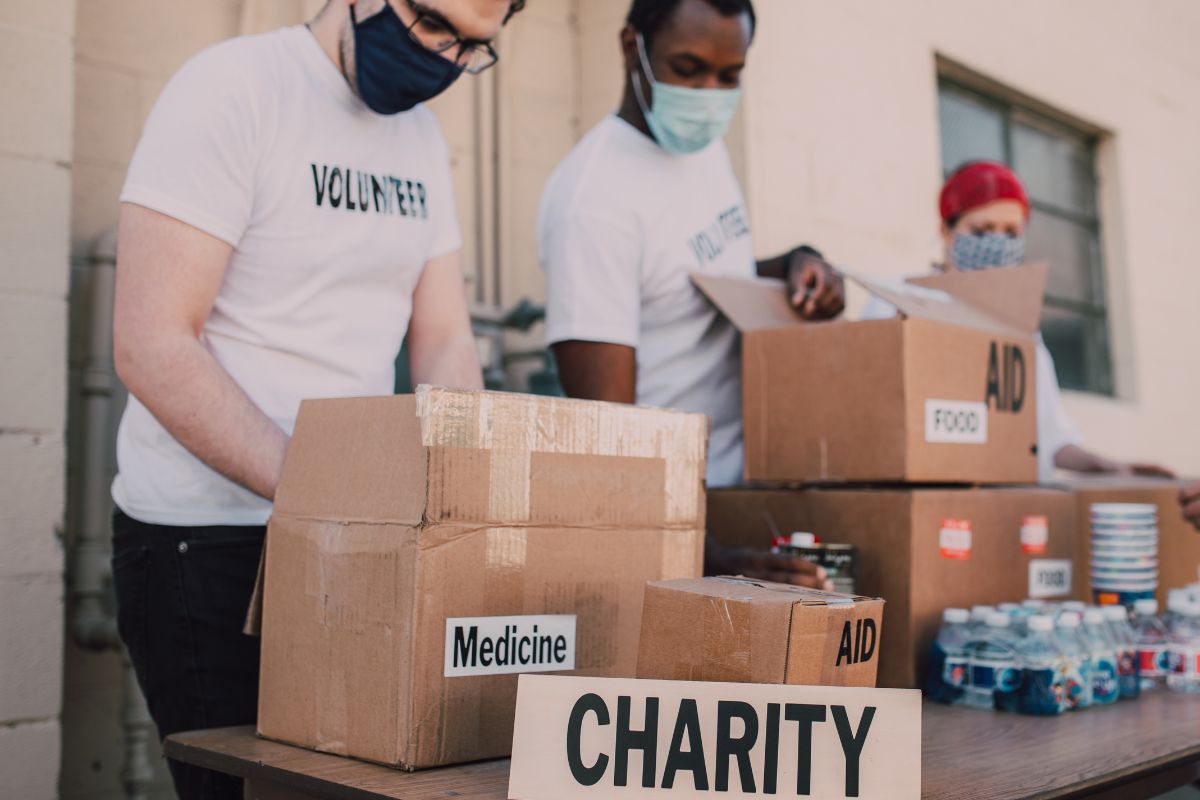 The picture shows a group of volunteers in a charity.