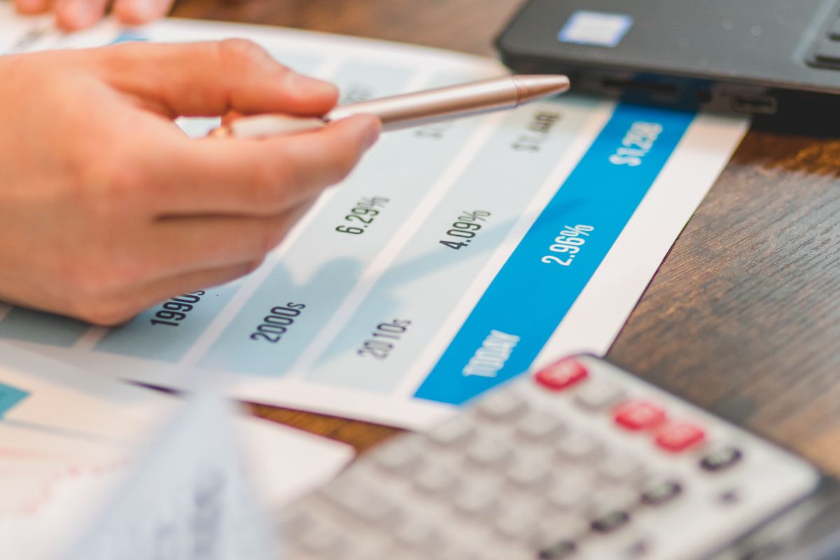 The image shows a man doing a business plan.