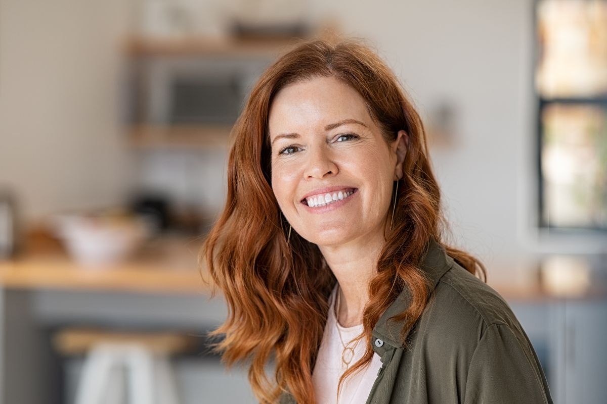 The image shows a happy woman.