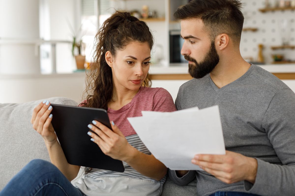 Picture of a couple talking about their debt.