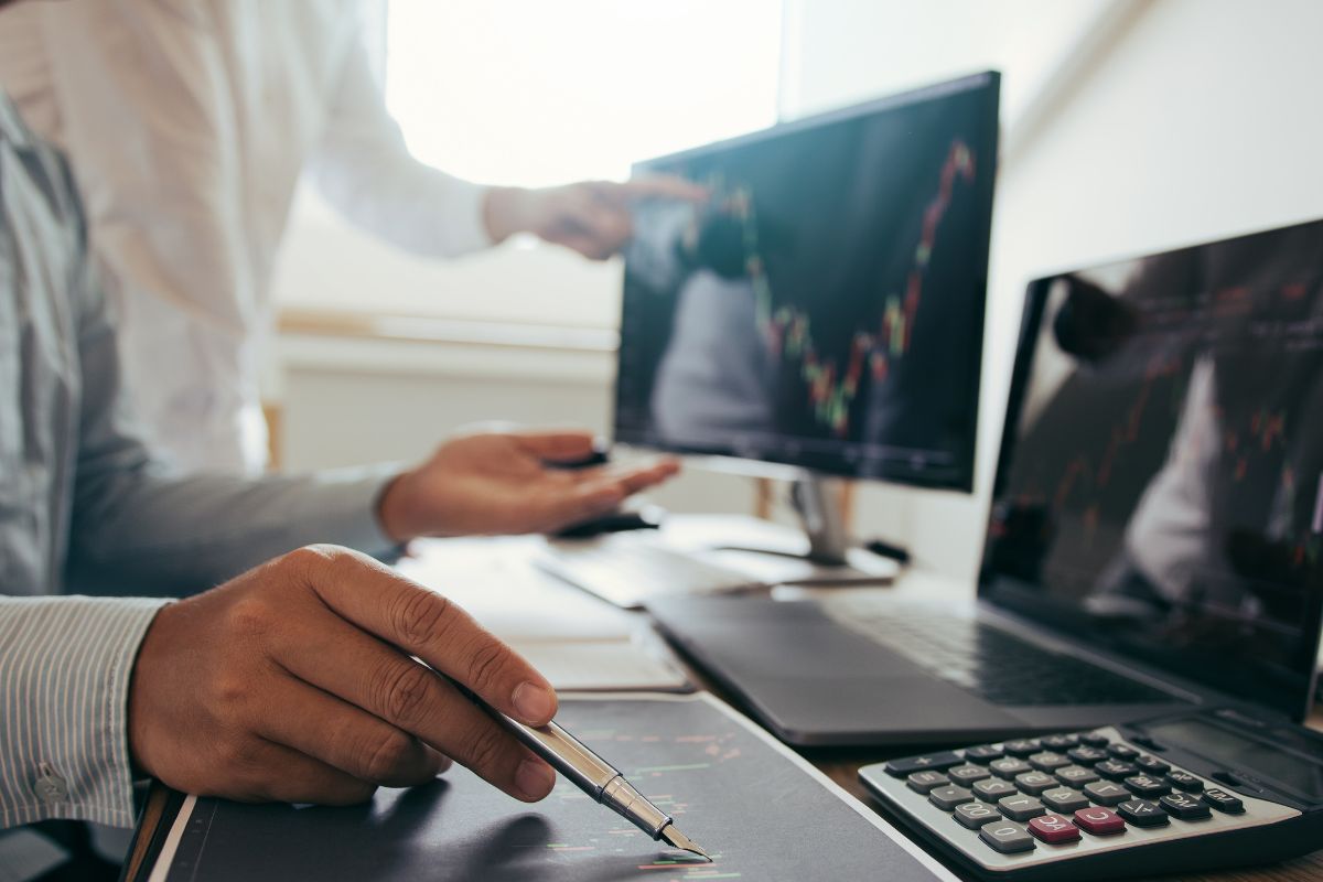 Picture of men monitoring the stock market.