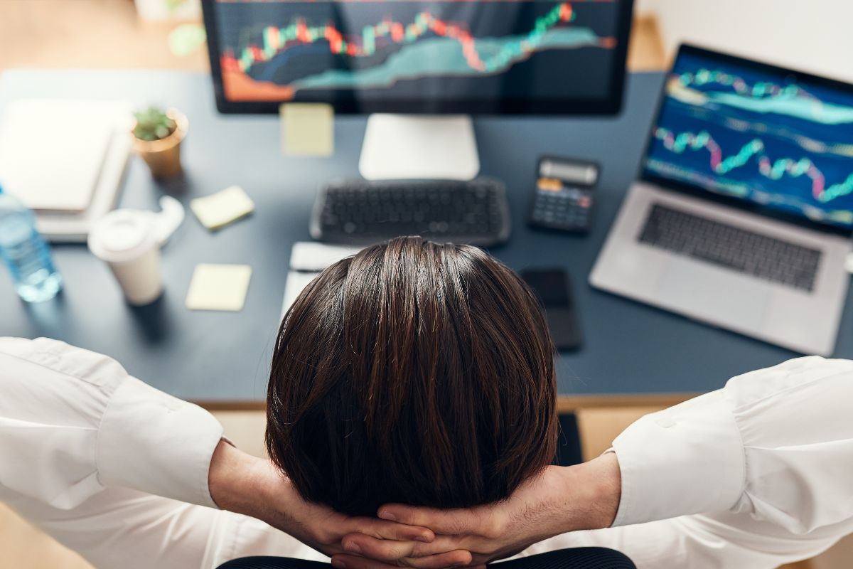 Photo of a man monitoring his investment.