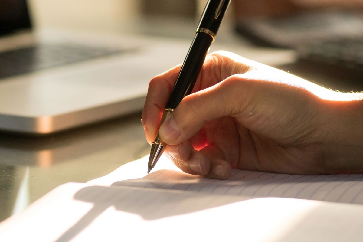 A woman's hand creates a daily routine.
