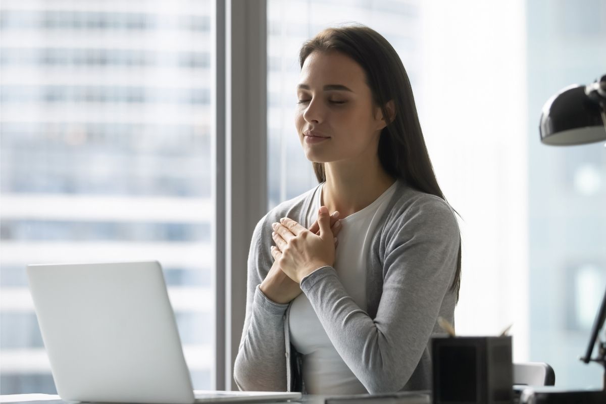 The image shows a woman with gratitude.