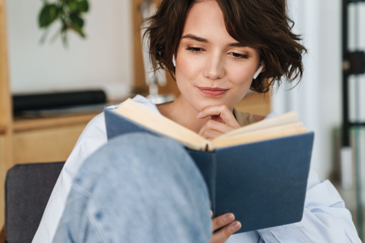 Picture of a woman reading a book.