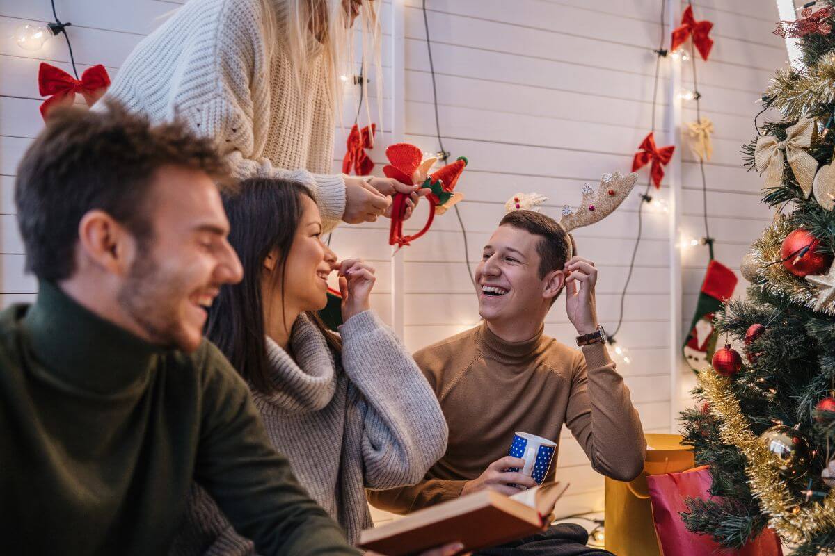 The picture shows a group of people having fun together on Christmas which refers to find experiences to give  this season that bring joy and leave a lasting impression. 