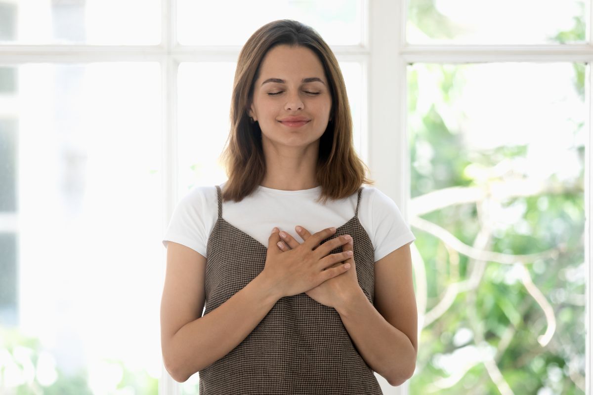 Photo of a woman showing gratitude.