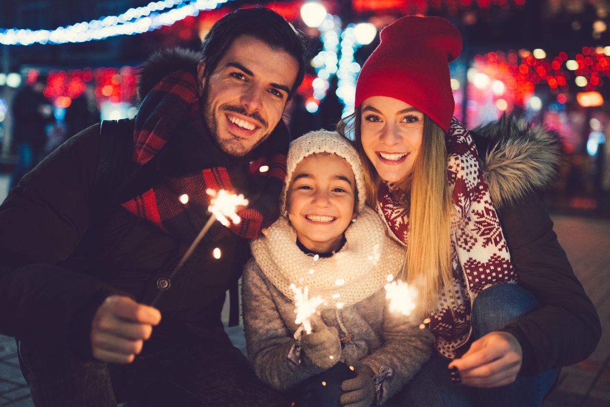Picture of a family celebrating Christmas outside.