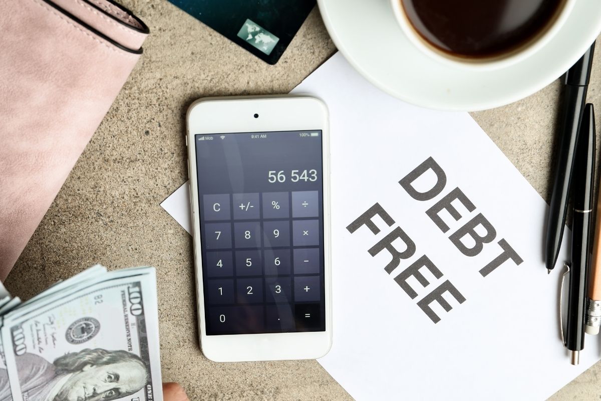 The photo shows debt-free wording and a phone.