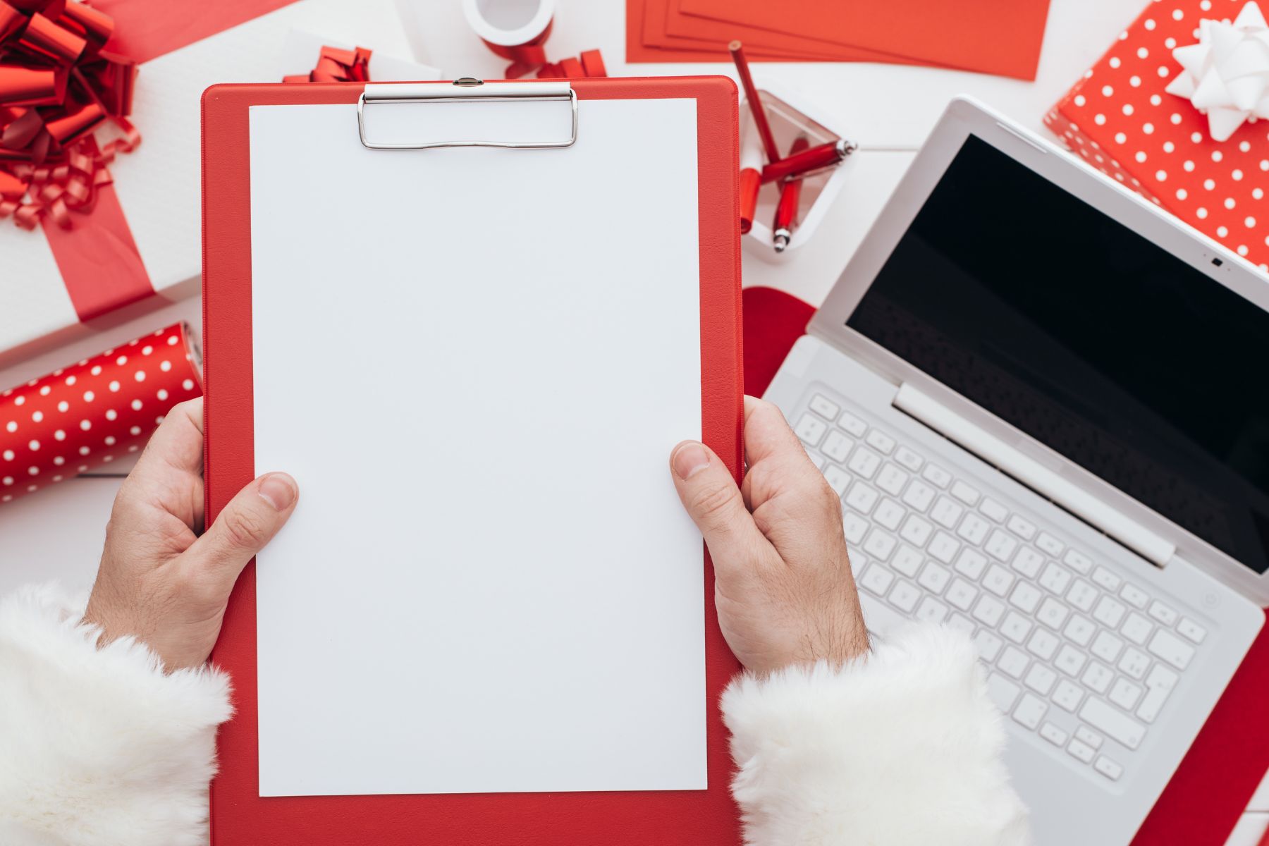 A man's hand planning for Christmas decorations.