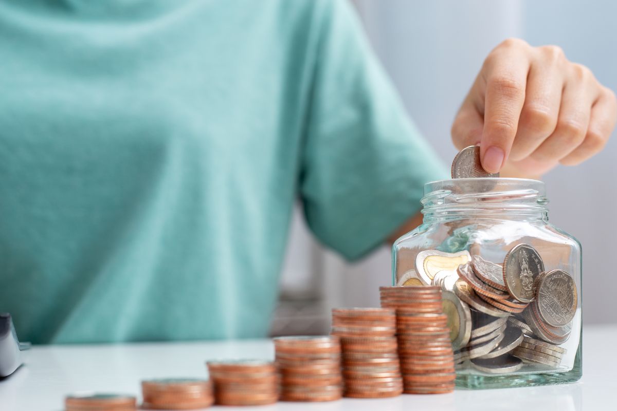 A woman is saving for a holiday fund.