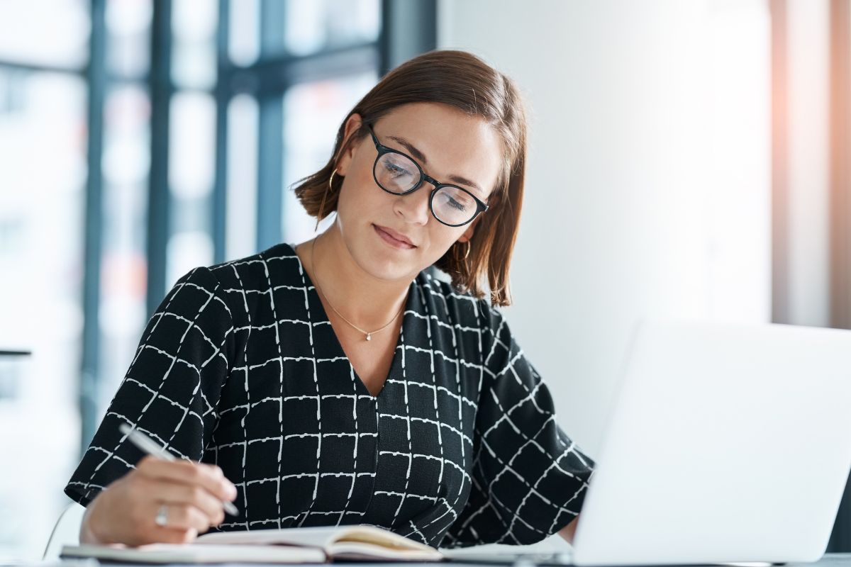 Photo of a woman reviewing her finances.