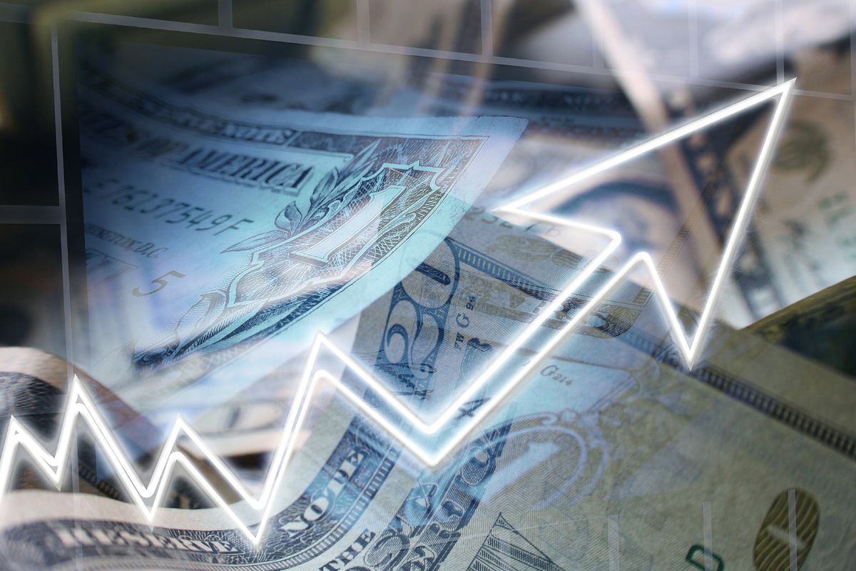 Picture of money and a rising arrow.