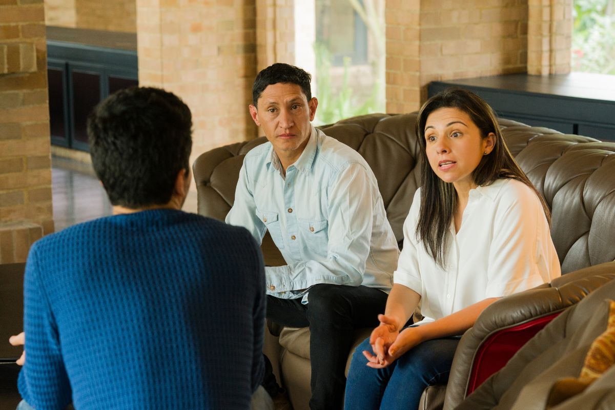 Picture of parents talking to their son.