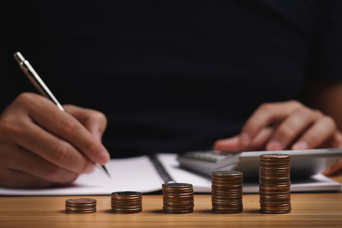 Picture of a man calculating his business income.