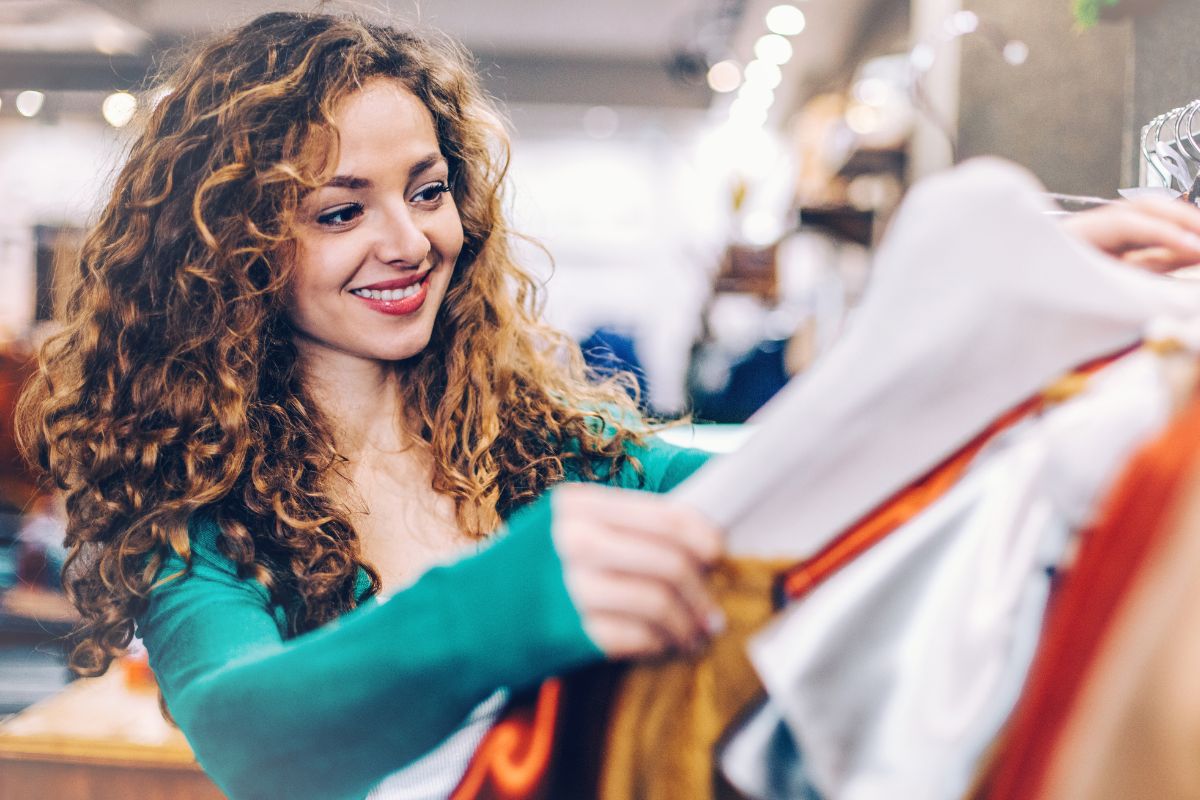 Picture of a woman shopping for clothes.