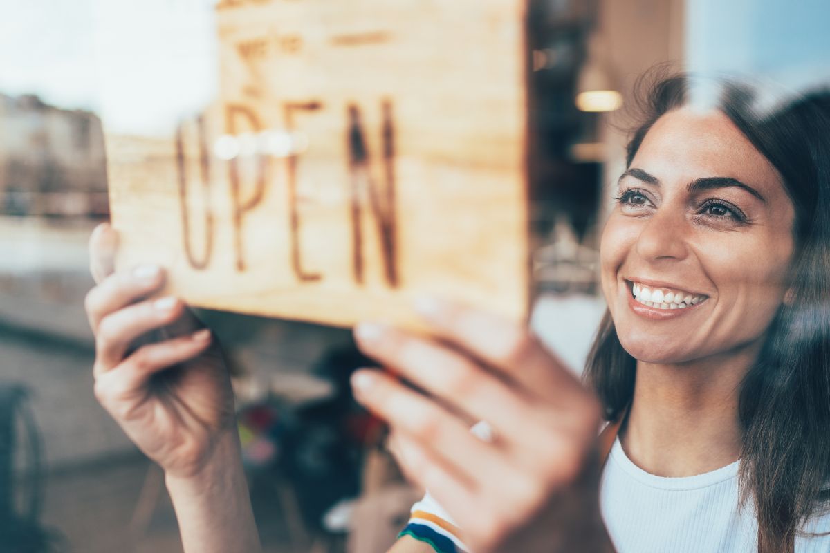 Photo shows a woman opening a business.