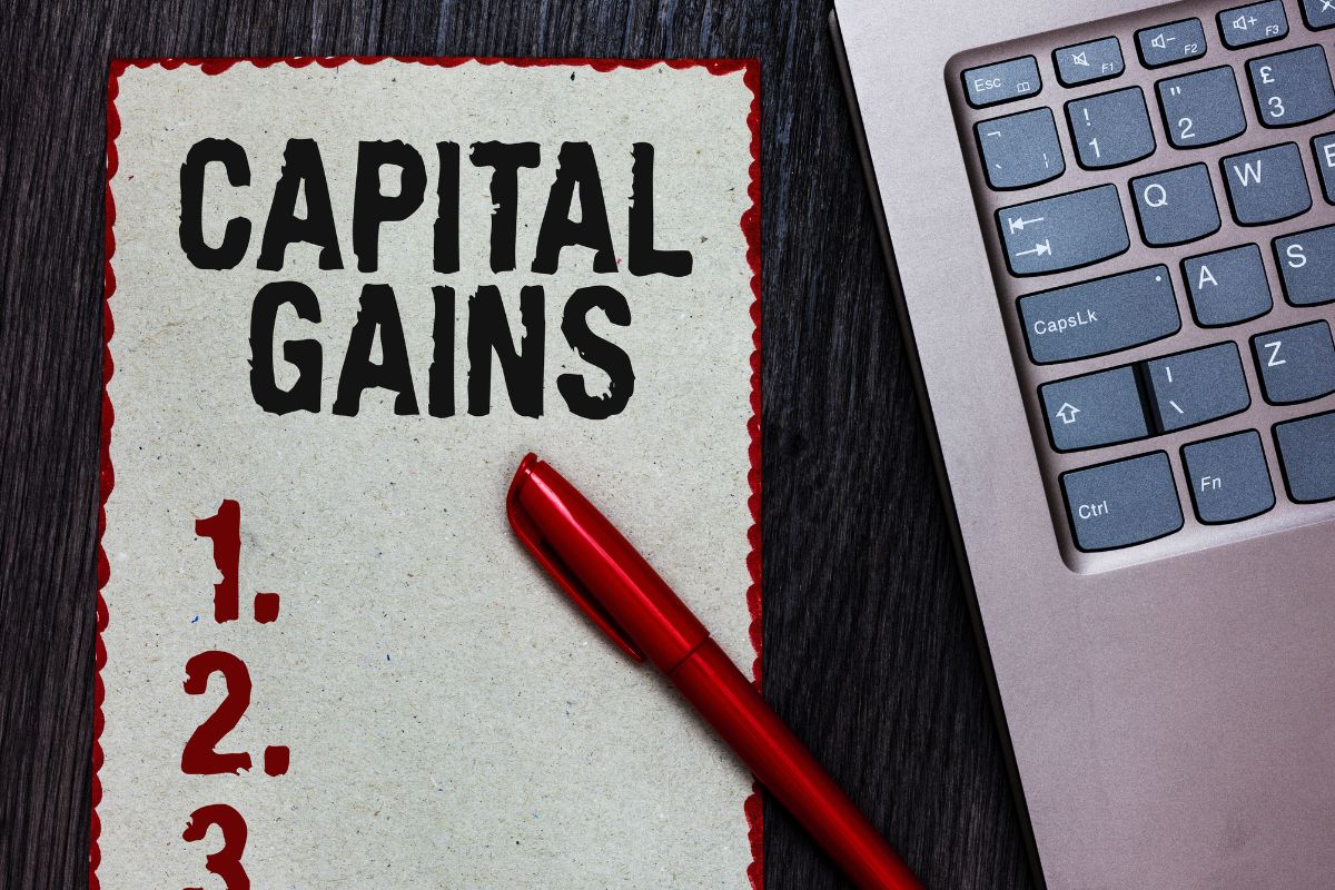 The picture shows a paper with capital gains wording.
