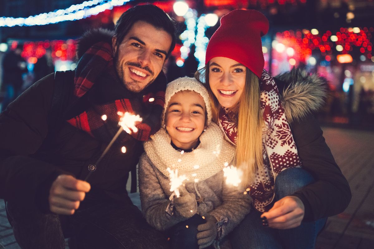 The image shows a family celebrating Christmas.