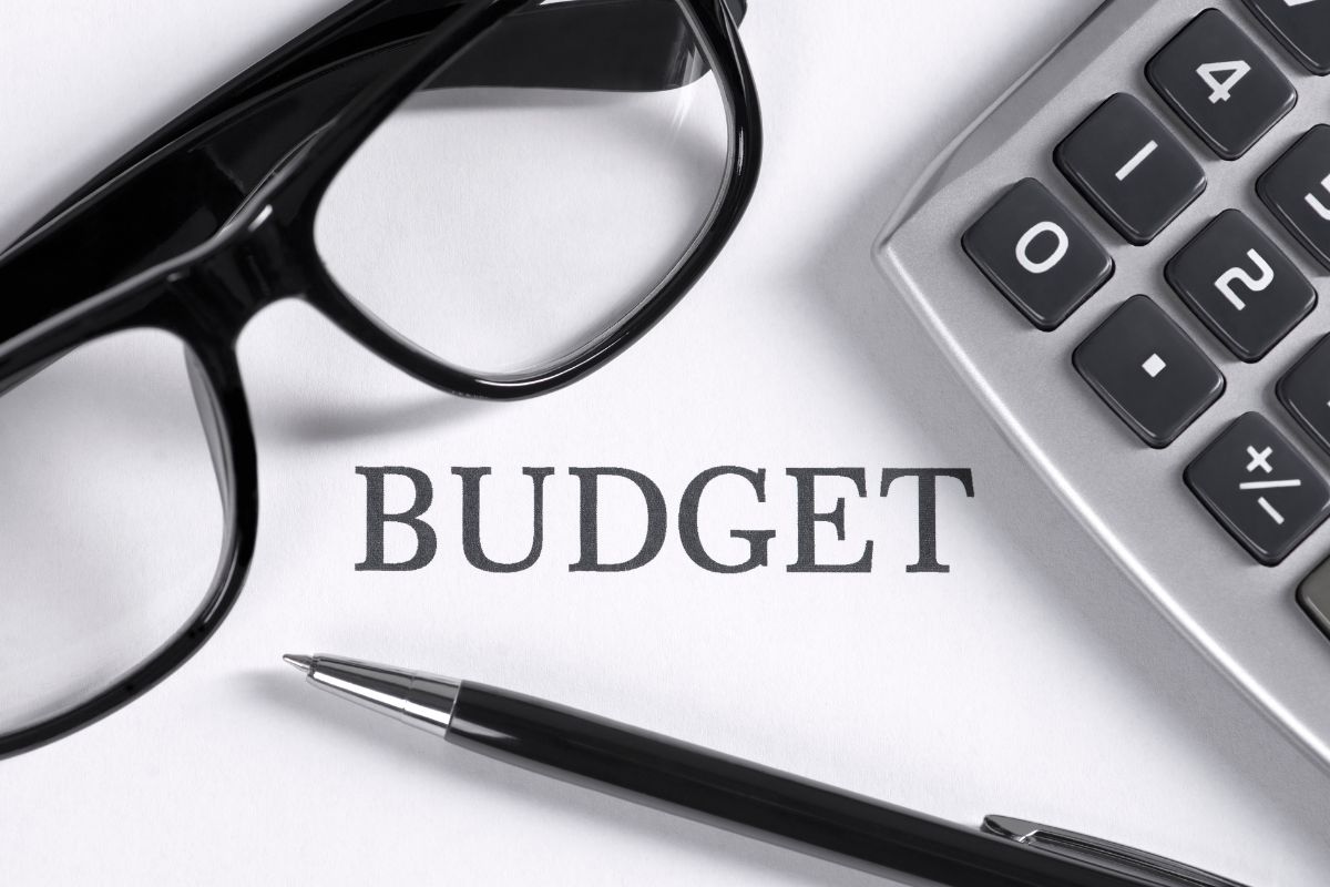 The image shows a paper with budget wording.