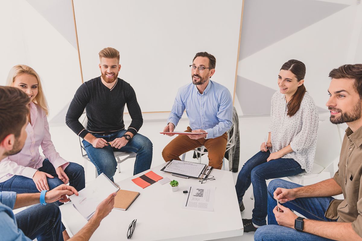 The picture shows a group discussion.